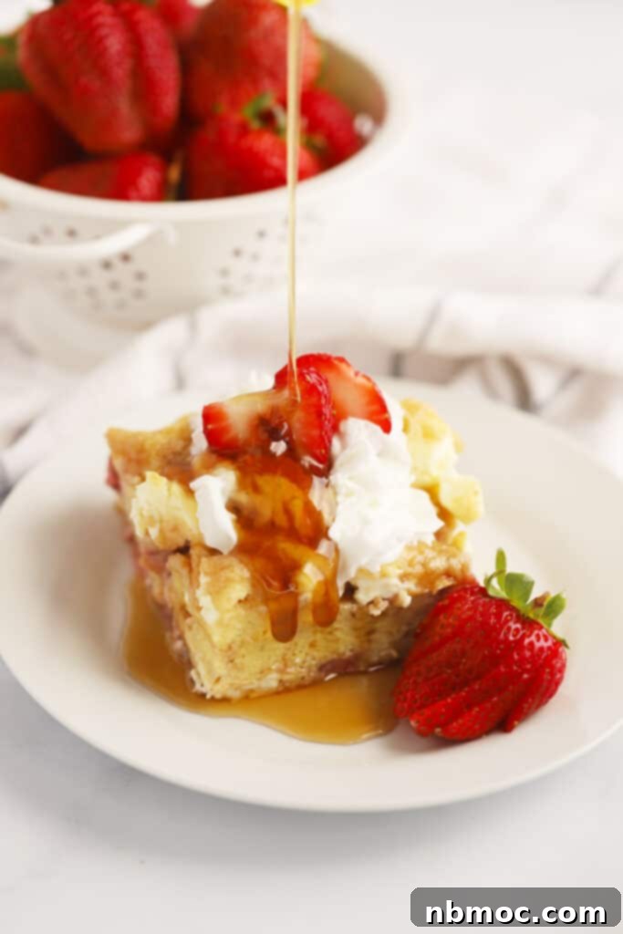 A delicious strawberry and cream French toast bake, topped with fresh berries and streusel, perfect for a special brunch.