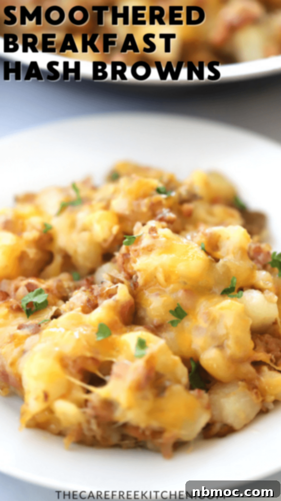 A pan of cheesy, smothered hash browns with bacon and ham, served for a hearty breakfast or brunch.