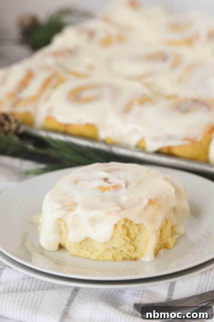 Pumpkin sweet rolls with cream cheese frosting, a perfect treat for autumn brunches.