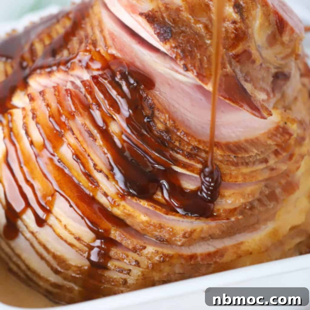 A beautifully glazed spiral ham, shimmering with honey glaze, ready to be carved and served at a festive brunch.