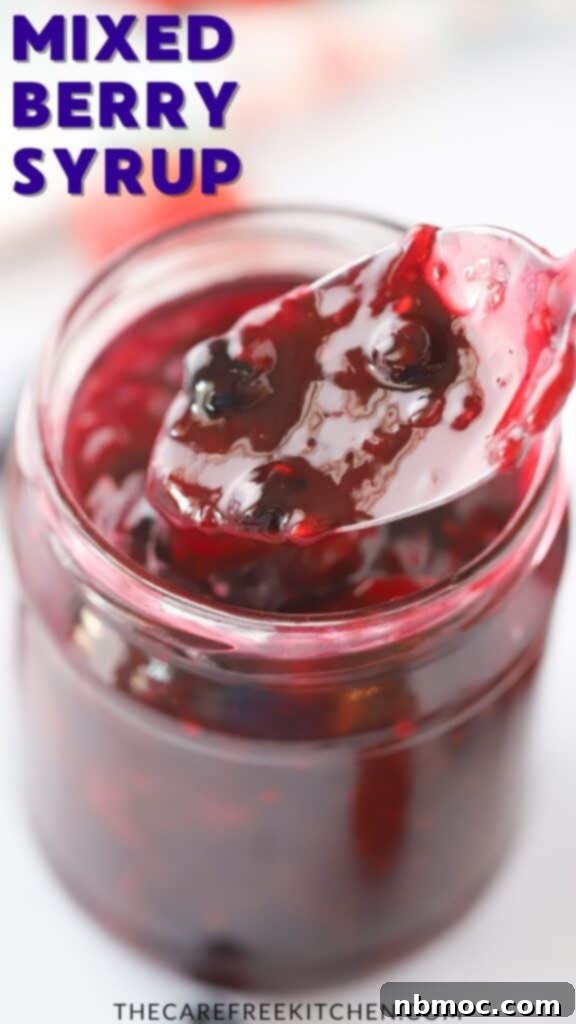 A bowl of mixed berry sauce, vibrant and sweet, perfect for topping pancakes or French toast.