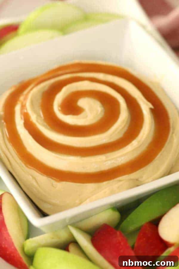 Cream cheese caramel apple dip, creamy and sweet, served with apple slices.