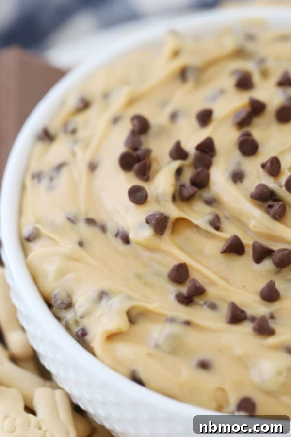 A bowl of chocolate chip dip with cream cheese and peanut butter, inspired by buckeyes.