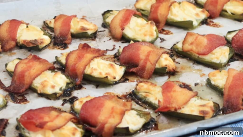 Bacon wrapped jalapeno poppers, baked to perfection, a delicious and easy appetizer recipe.