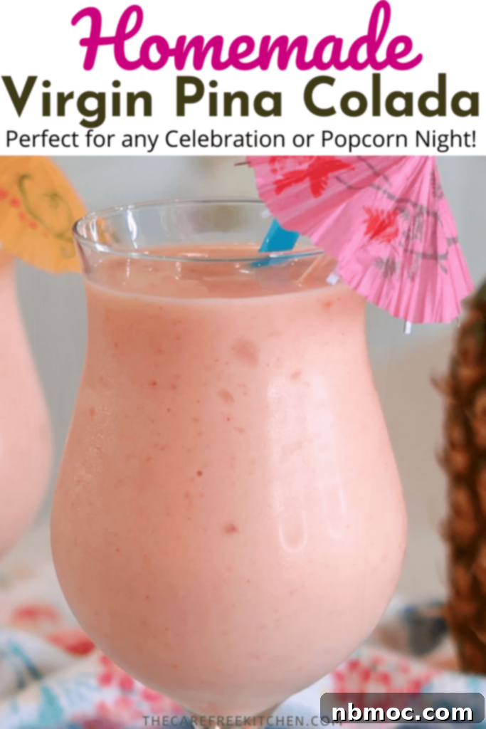 A refreshing virgin strawberry piña colada in a glass, garnished with fruit, perfect for summer.