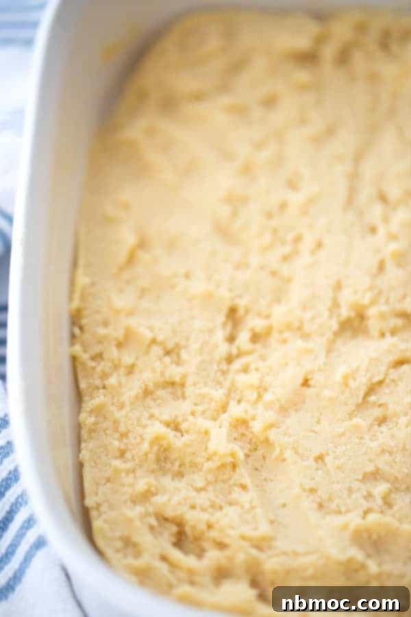 Soft and Chewy Sugar Cookie Bars with a Zesty Lime and Coconut Frosting