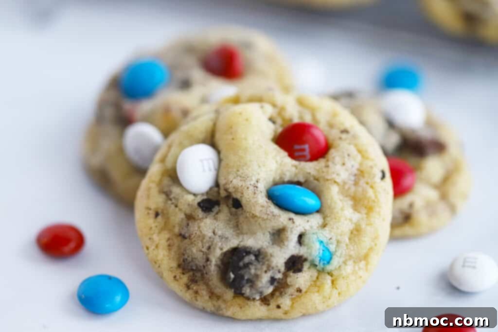 Festive Oreo and M&M Cookies with red, white, and blue candies, perfect for 4th of July parties.