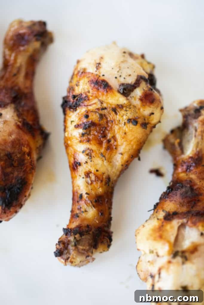 Grilled chicken drumsticks on a countertop made with our mediterranean chicken drumsticks marinade for grilling.