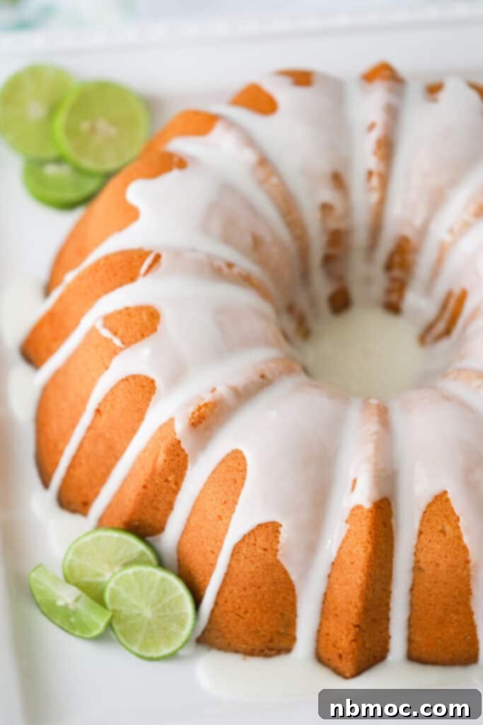 Florida Keys Pound Delight 5 A full pound cake baked in a bundt cake pan, topped with white glaze with fresh slices of lime on the side.