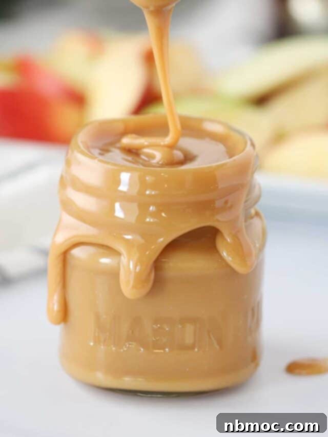 21+ Decadent Caramel Dessert Recipes 3 Silky smooth homemade caramel sauce in a jar, perfect for drizzling.
