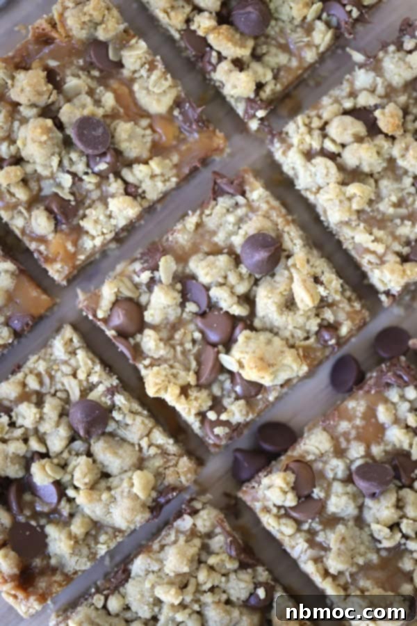 21+ Decadent Caramel Dessert Recipes 21 Caramel Peanut Butter Cookie Bars, neatly cut into squares and arranged on a baking sheet.