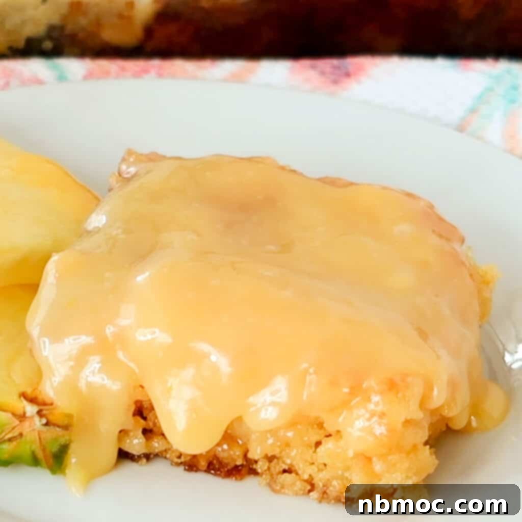 21+ Decadent Caramel Dessert Recipes 6 An old-fashioned pineapple cake presented on a white plate, adorned with a slice of fresh pineapple.