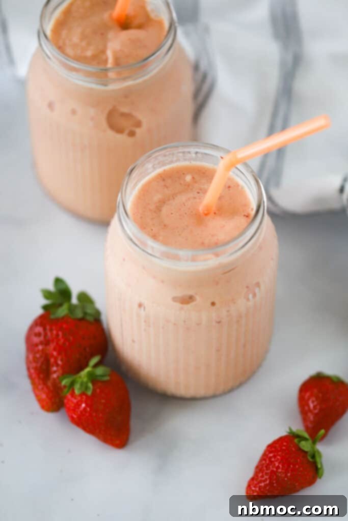 Creamy Citrus Berry Swirl 2 Two glasses full of this strawberry orange julius recipe.