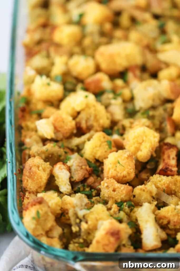 A baking dish filled to the brim with our perfectly prepared easy cornbread stuffing, golden brown and ready to be served.