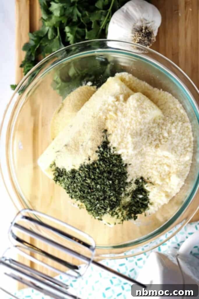 Artisan Garlic Butter 3 A glass bowl showcasing all the measured ingredients for the homemade garlic butter spread recipe.