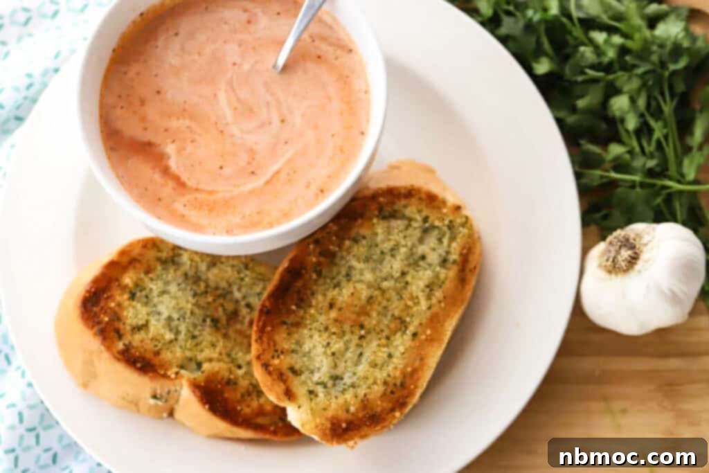 Artisan Garlic Butter 6 Garlic bread spread served with a comforting bowl of soup, highlighting its versatility in meals.