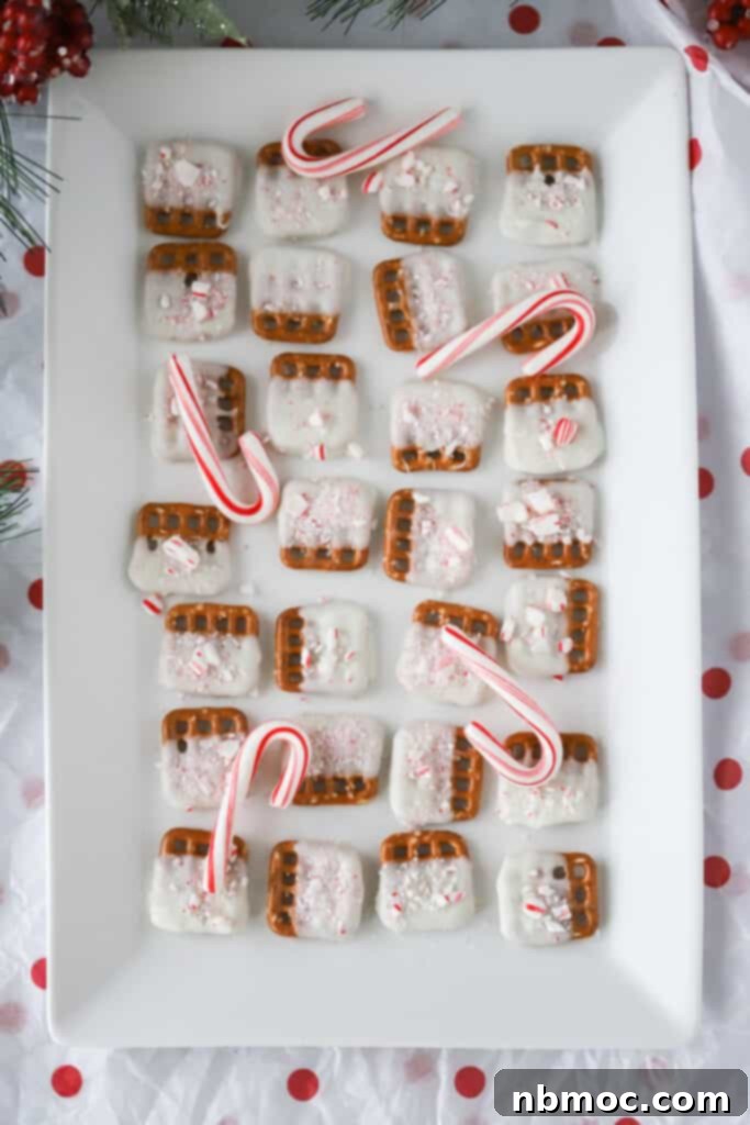 Mint Kissed Pretzel Crunch 5 A white serving tray full of chocolate covered Peppermint Pretzels