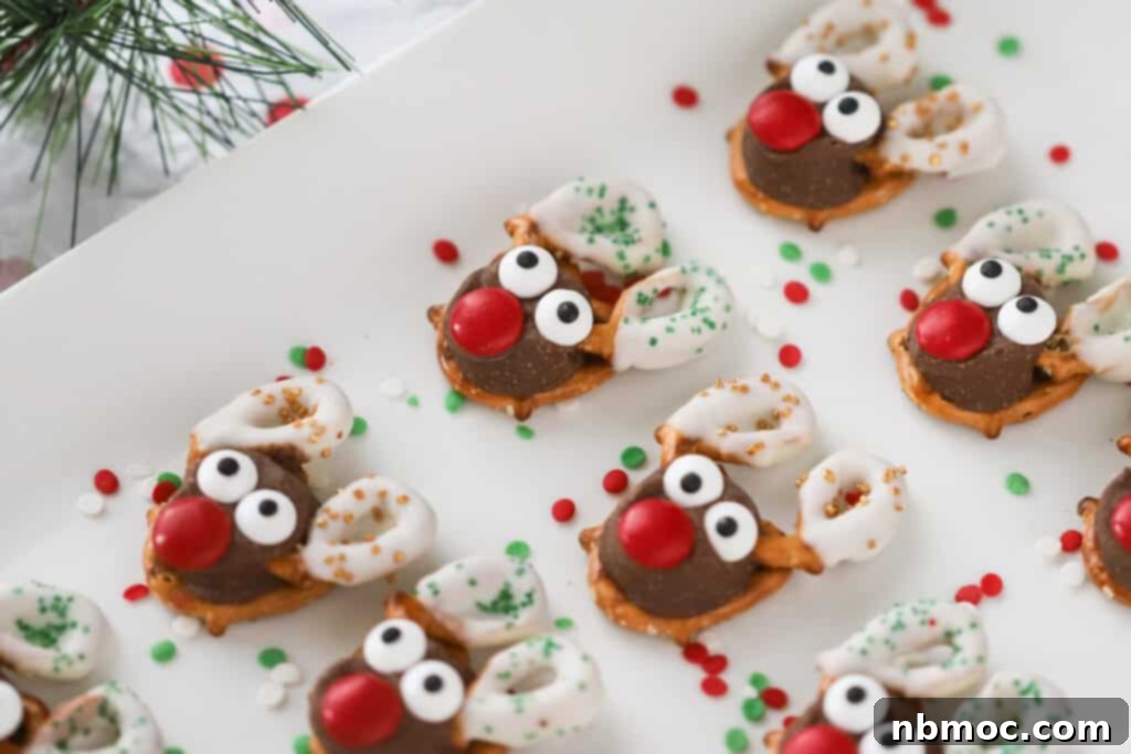 Holiday Antler Pretzels 3 A white serving platter with decorated Reindeer Pretzels lined up, ready for a festive gathering.
