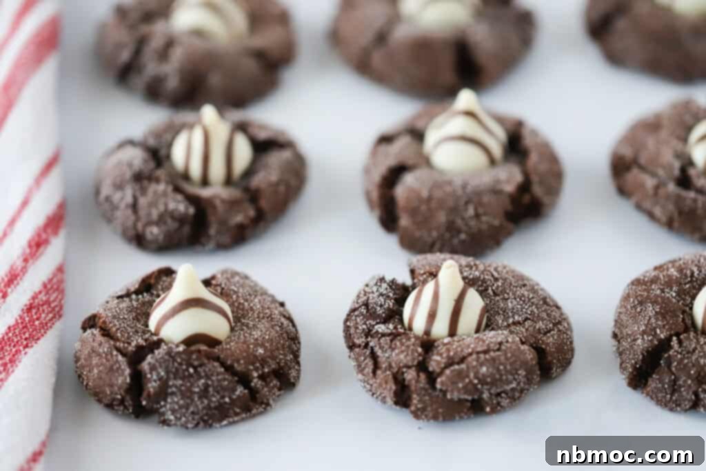 Irresistible Chocolate Kisses 5 A platter full of Chocolate Kisses Cookies topped with striped Hershey's Kisses.