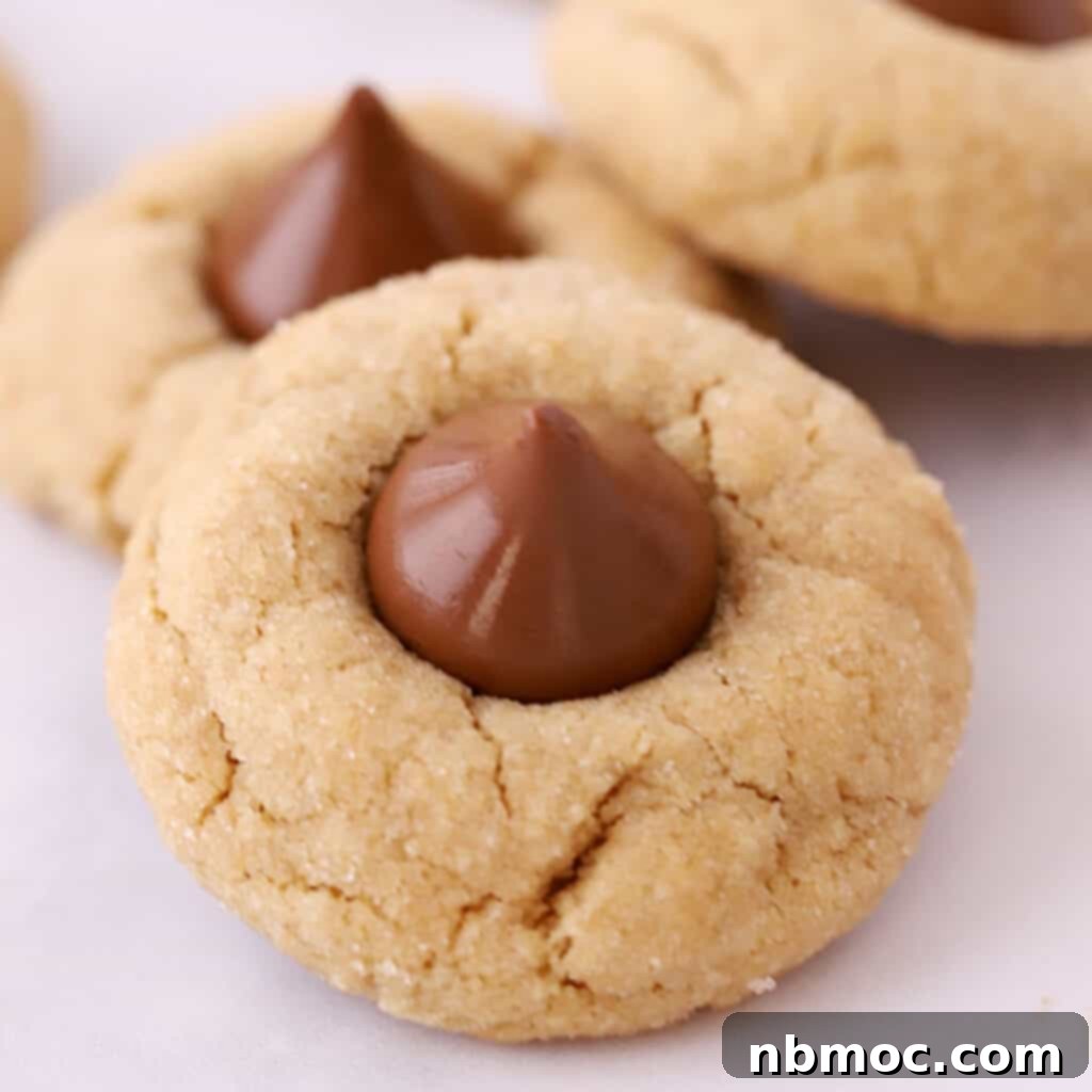 peanut butter blossom cookies on parchement paper