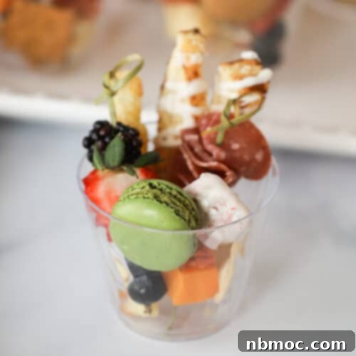 Individual appetizer cups, showcasing various charcuterie cup ideas.