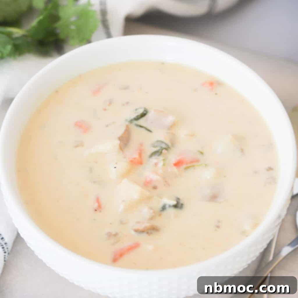 Valentines Day Dinner Inspiration 19 A hearty bowl of Tuscan Soup, rich with Italian sausage, potatoes, and spinach, a warming dish for Valentine's dinner.