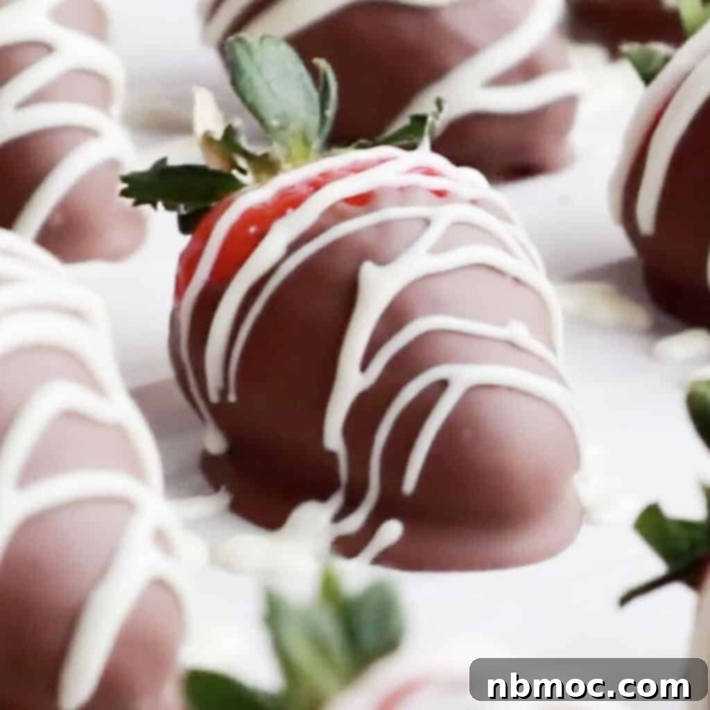 Valentines Day Dinner Inspiration 25 An array of glossy chocolate-dipped strawberries artfully arranged on a white serving tray, the quintessential romantic Valentine's dessert.