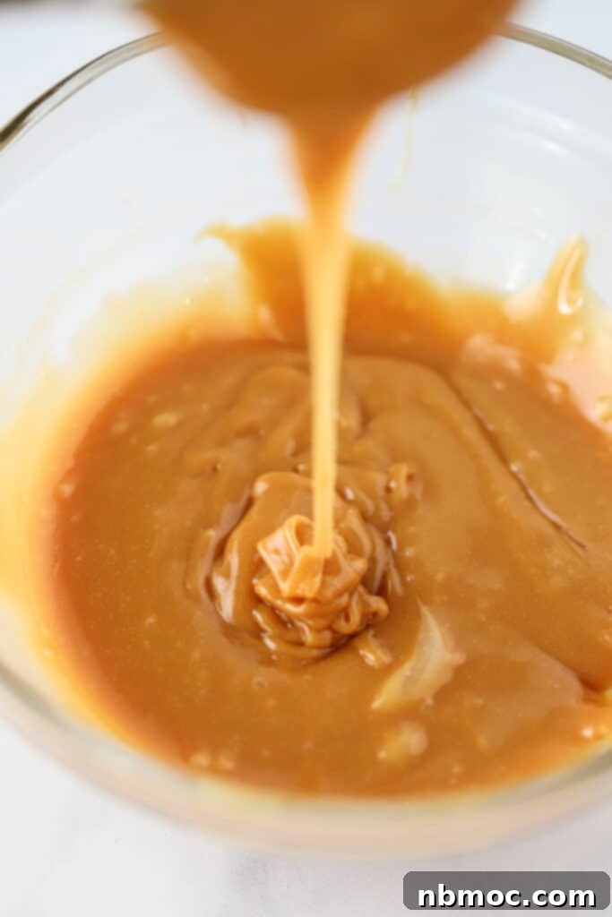 Melted caramel in a glass bowl.