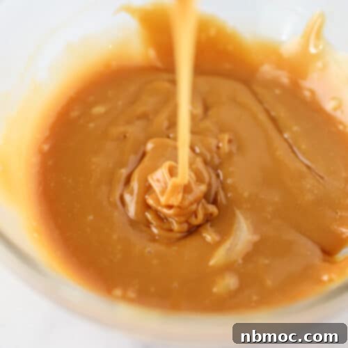 Melted caramel in a glass bowl.