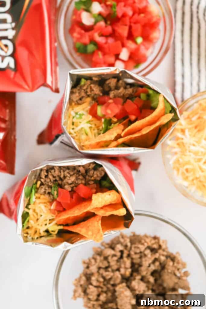 Delicious Walking Tacos served in snack-sized Doritos bags, highlighting their portability and appeal as party food.