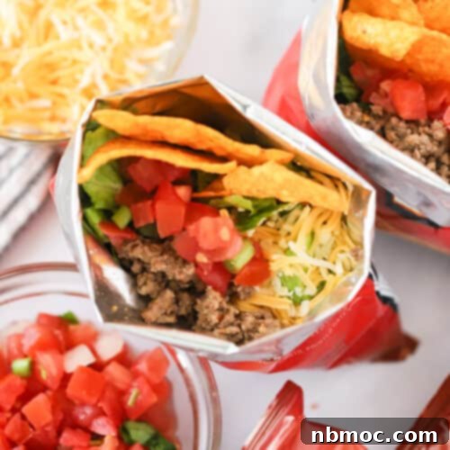 A perfectly assembled Walking Taco in a Doritos bag, ready to be enjoyed.