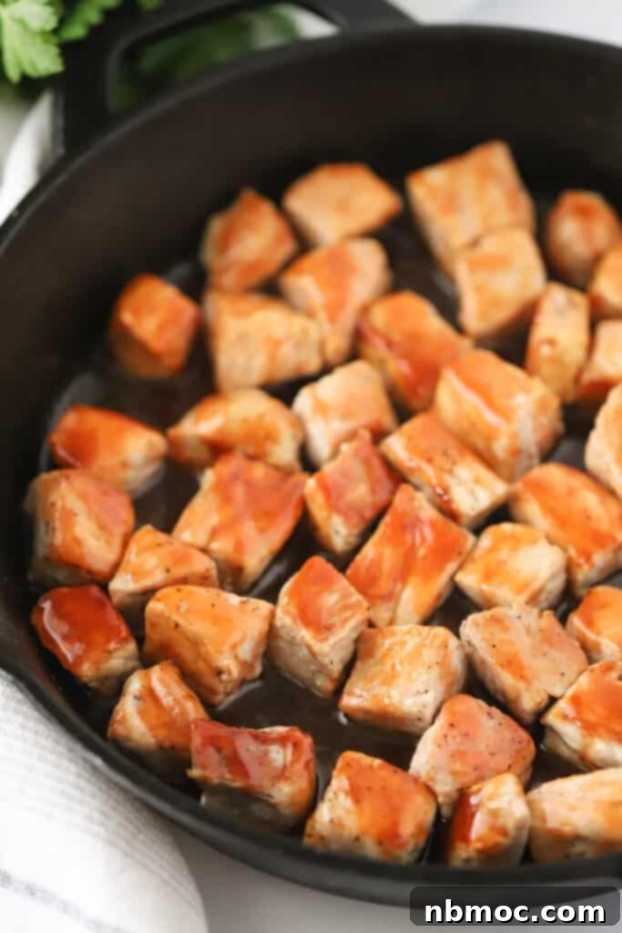 Buffalo Pork Poppers 2 Buffalo Pork Bites in a cast iron skillet.