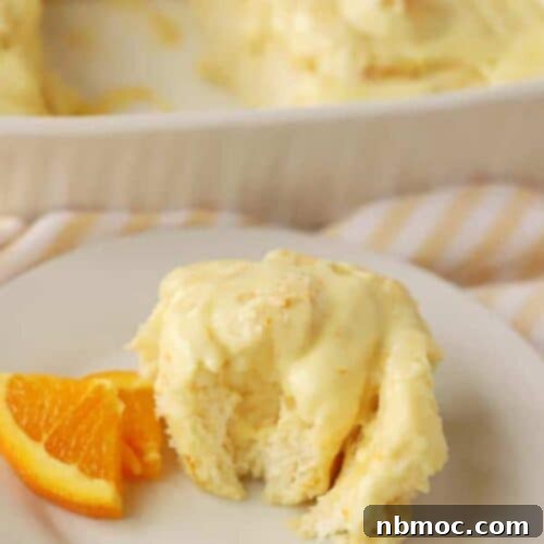 Homemade orange sweet rolls with creamy orange dreamsicle frosting