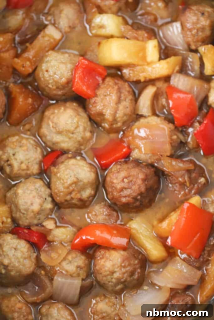 Crockpot Sweet and sour meatballs with peppers and pineapples. Sweet and sour meatballs slow cooker. Slow cooker meatballs sweet and sour.