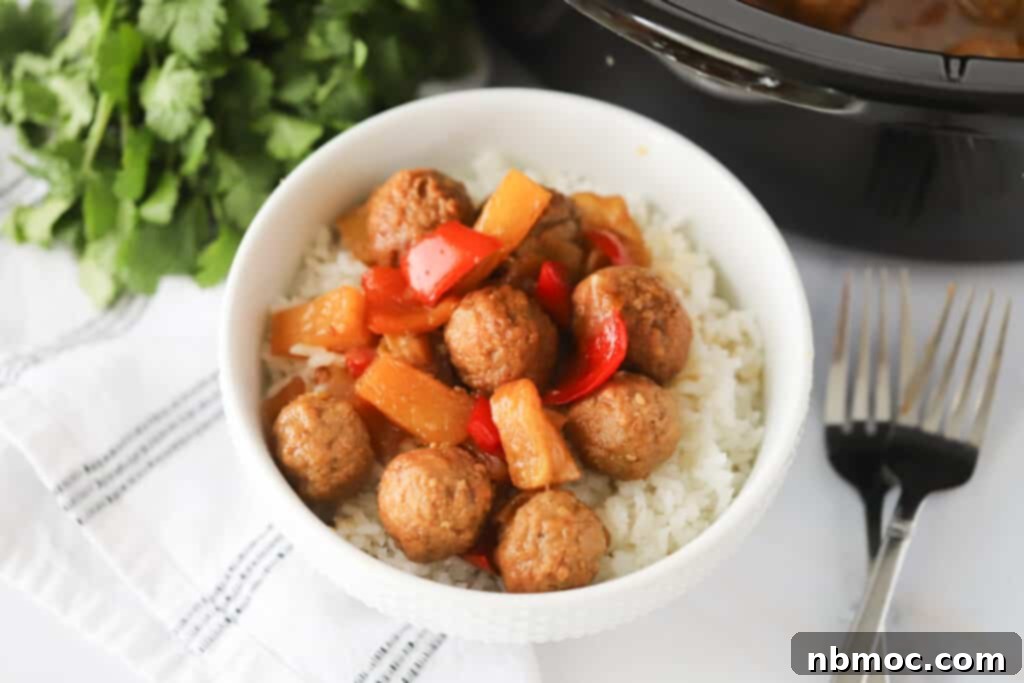 Sweet and sour meatballs crockpot recipe with red peppers and pineapples in a bowl over white rice. Sweet and sour meatballs slow cooker, sweet and sour crock pot meatballs, sweet and sour meatballs crock pot 
