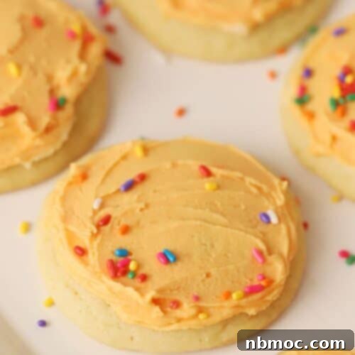 Orange Creamsicle Cookies with sprinkles, showcasing the perfect frosting and vibrant colors.