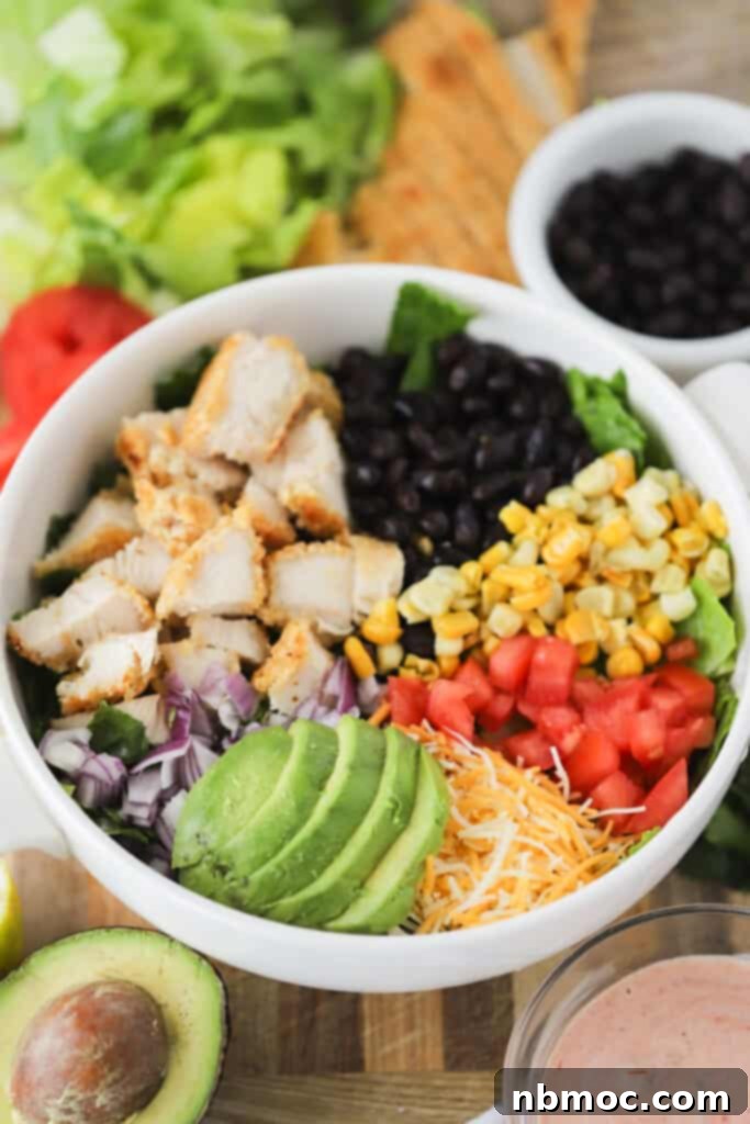 Fiesta Crispy Chicken Salad 2 A vibrant bowl of Southwest Crispy Chicken Salad, showcasing golden chicken pieces, corn, beans, and fresh greens.