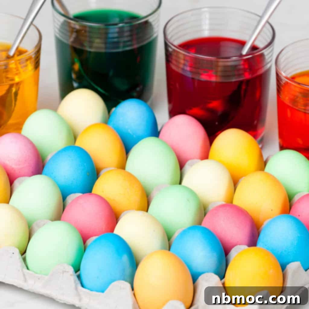 Crafting Colorful Easter Eggs 3 A close-up view of a hand dipping an egg into a cup of colorful dye, demonstrating how to dye Easter eggs.