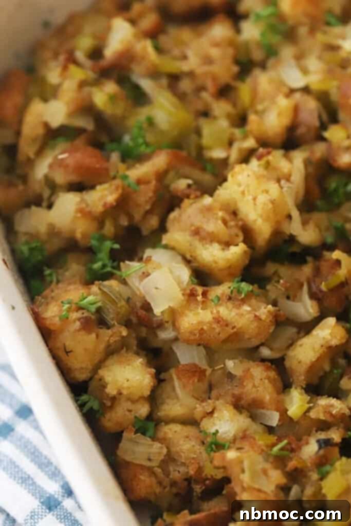 Turkey Stuffing recipe in a white baking dish, stuffing thanksgiving recipes. 