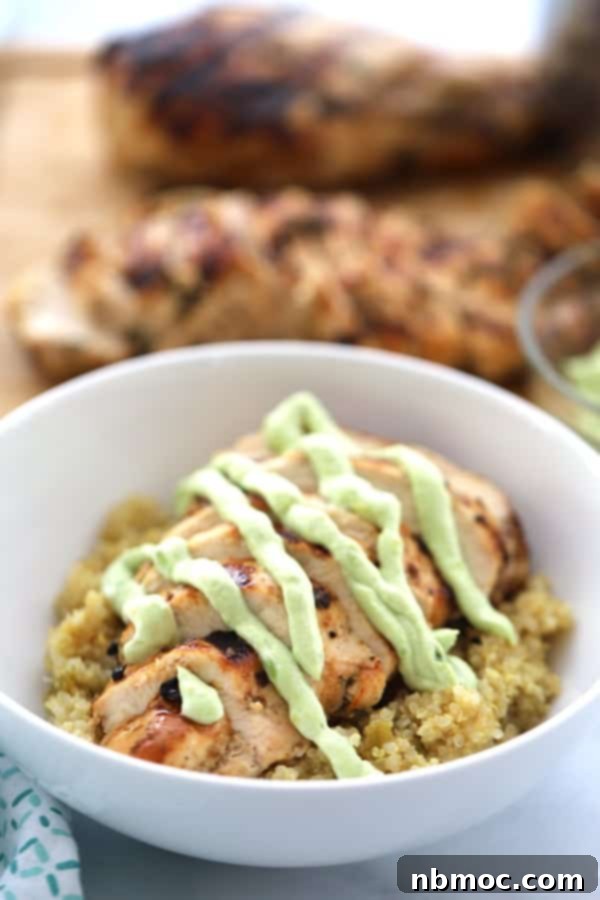 Zesty Cilantro Lime Chicken 2 Grilled cilantro lime chicken served with vibrant lime quinoa and a luxurious creamy avocado sauce, perfectly plated for a healthy and satisfying meal.
