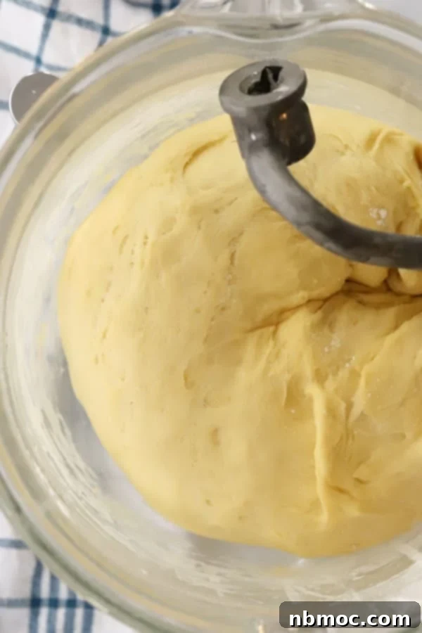 Fluffy Homemade Crescent Rolls 3 A glass mixing bowl with the dough for this crescent recipe.