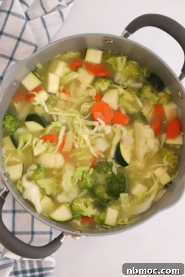ingredients for a hearty vegetable soup in a pot.