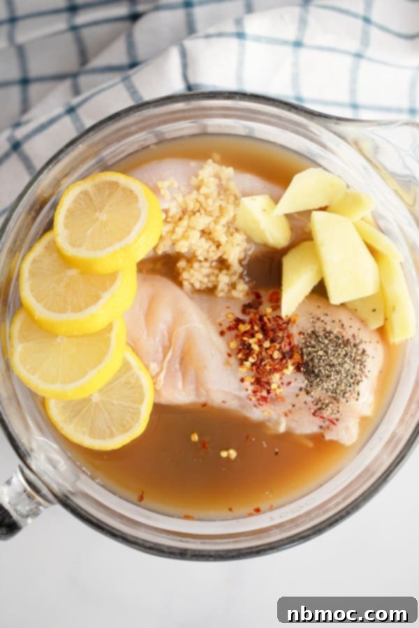 Baked Lemon Ginger Chicken Marinade; best baked ginger lemon chicken. A close-up shot of perfectly baked lemon ginger chicken, golden brown and glistening with sauce.