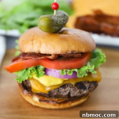 A delicious homemade hamburger recipe, showing a juicy patty, melted cheese, and fresh toppings.