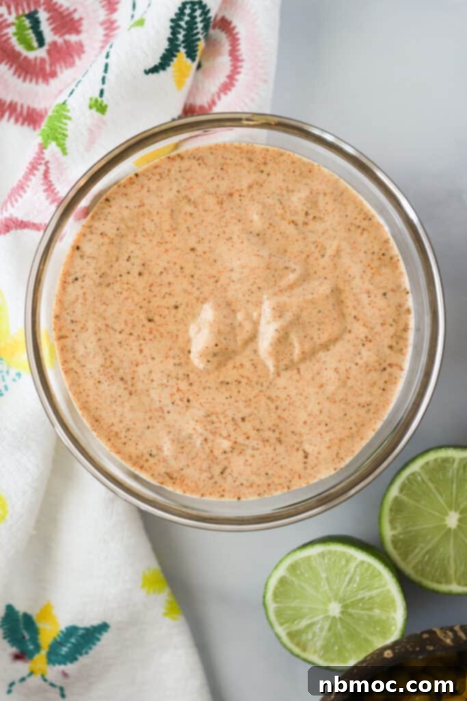 A small glass bowl full of chili lime mayo.