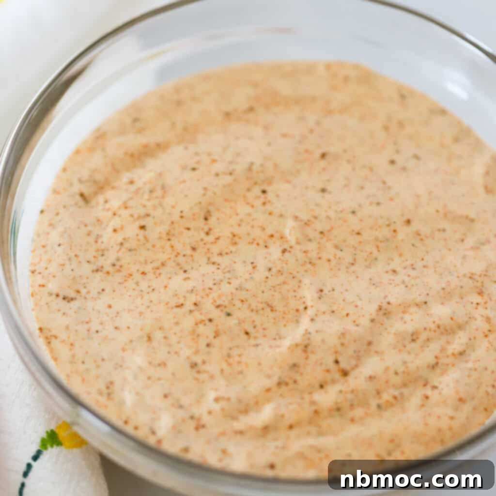 A glass bowl full of Chili Lime Mayo.