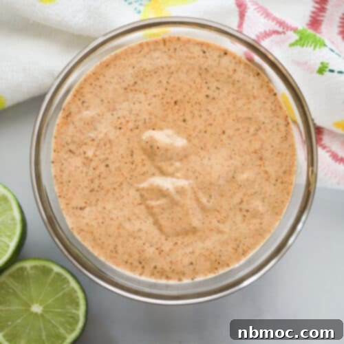 A glass bowl full of Chili Lime Mayo.