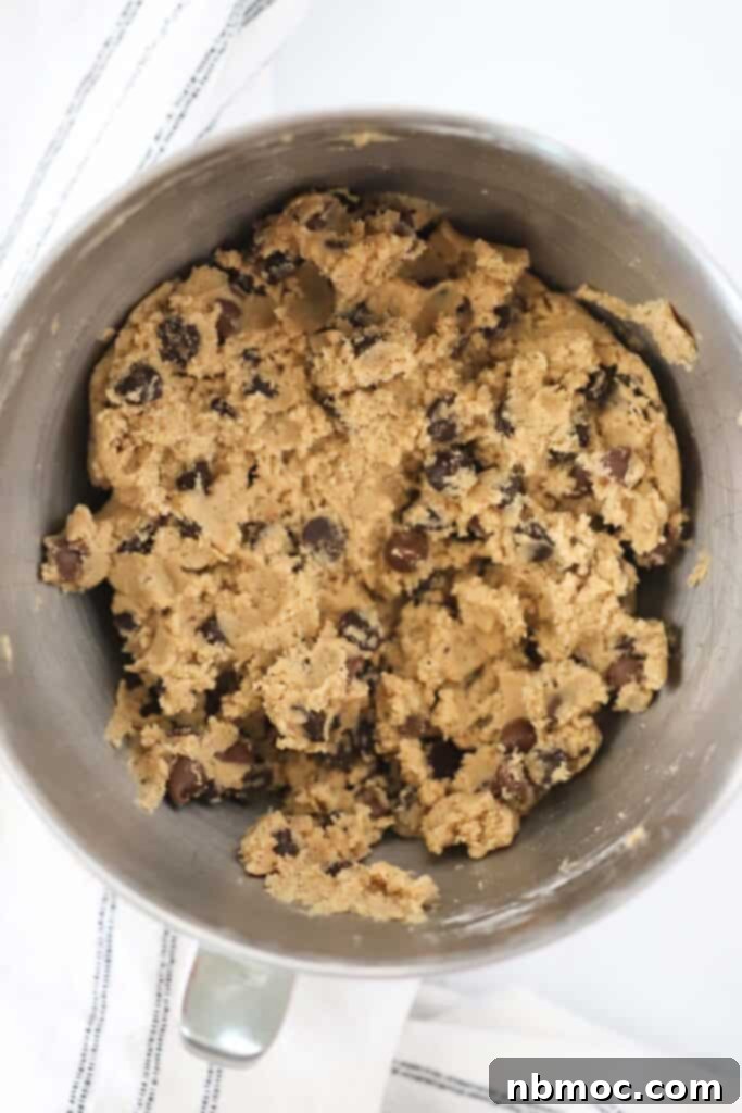 Best brown butter chocolate chip cookies cookie dough in a mixing bowl.