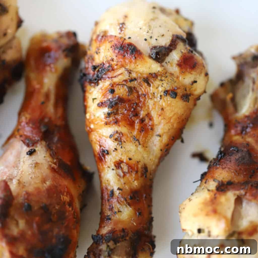 Mediterranean grilled chicken on a white plate, chicken drumstick marinade for bbq, mediterranean chicken legs on the grill.