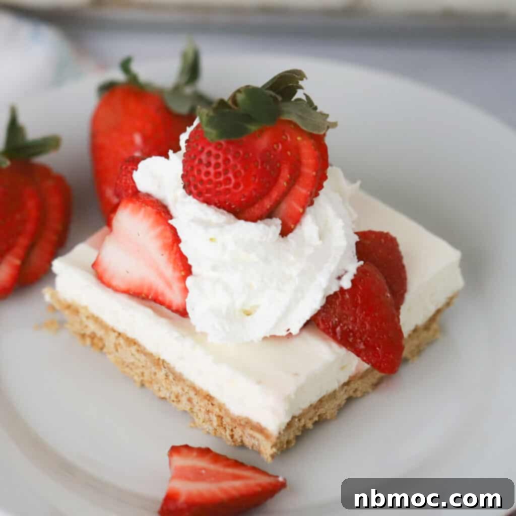 no bake cheesecake bars served with strawberries and whipped cream topping, memorial day menu